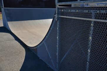 metal construction ramp for skateboarding, serves as a platform for riding with an inline scooter...