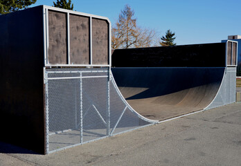 metal construction ramp for skateboarding, serves as a platform for riding with an inline scooter...