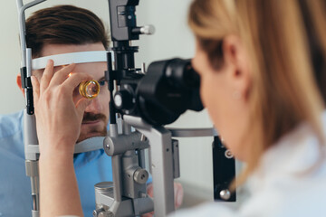 man has eyesight examination at clinic