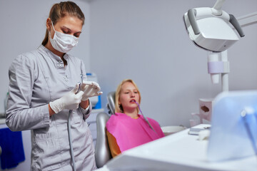 Mouth checkup at the young dentist's office