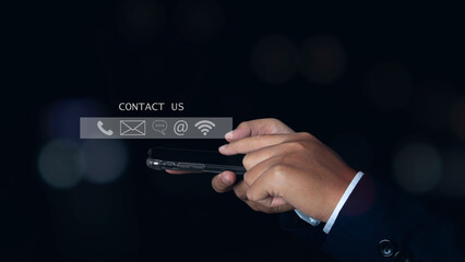 Businessman hand using smartphone with icon phone, chat message icon, mail, and address.
