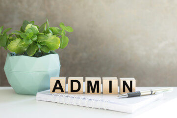 ADMIN word built with letter cubes on a table