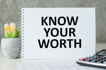 Know Your Worth text on a notebook on a desk, a business concept