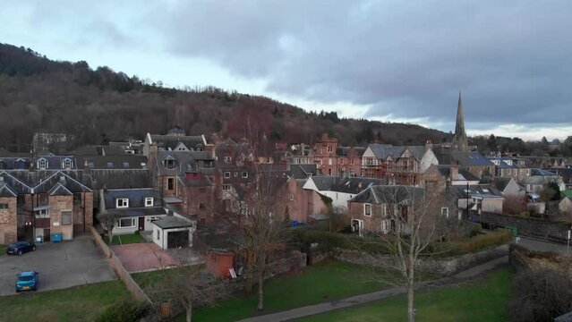 Drone footage. Slowly ascending over the town of Callander, Scotland, Highlands  