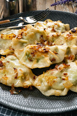 Fried dumplings (pierogi) with spinach.