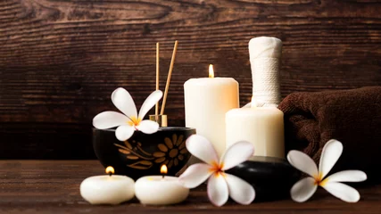 Fototapeten Thai spa massage. Spa treatment cosmetic beauty. Therapy aromatherapy for care body women with candles for relax wellness. Aroma and salt scrub setting ready healthy lifestyle. © freebird7977