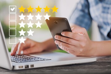 Satisfied customers rate the product or service online with five stars concept