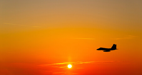 Fototapeta na wymiar War aircrafts at sunset sky.