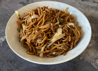 Stir fried noodles spring onions, bamboo shoots, soybean sprouts. Vegetarian food concept.