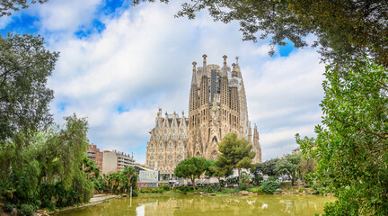 Sagrada Familia, a large Roman Catholic church in Barcelona, Spain, designed by Catalan architect Antoni Gaudi - obrazy, fototapety, plakaty