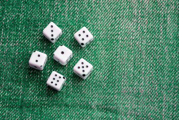 Game dices on green background. Gambling table