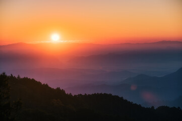 Sunrise over mountain with colorful sky in tropical rainforest at national park in the morning