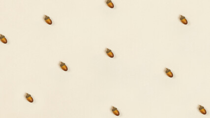 Minimalistic photo painting pattern with acorns in trendy brown - beige color with an autumn motif