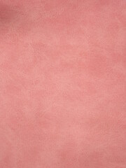 pink suede of a non-uniform color as a background