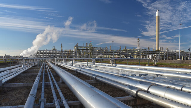 natural gas pipeline - pipes and buildings of a refinery - industrial plant for fuel production