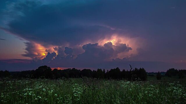 Time lapse of supercell moving right over landscape; weather phenomena