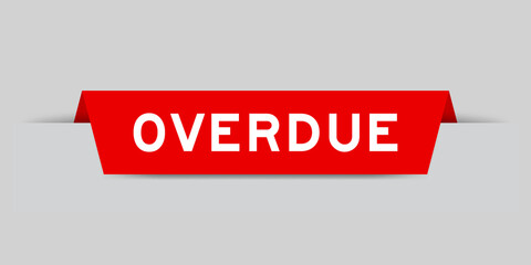 Red color inserted label with word overdue on gray background