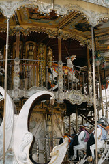  Children's circular carousel with horses in Paris to Montmartre near the Basilica Church.