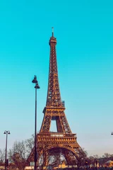 Acrylic prints Turquoise . The Eiffel Tower against a perfectly blue sky. Beauty travel in Paris, touristic place.