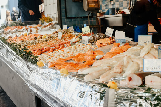 Seafood stall on the street, salmon, shrimp and white fish, a large selection of healthy food in the market.