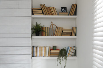 Obraz na płótnie Canvas Many shelves with different decor in room. Interior design