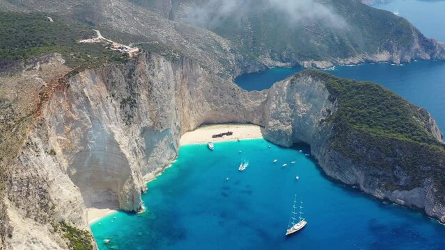 View of Navagio beach, Zakynthos Island, Greece. Aerial landscape. Azure sea water. Rocks and sea. Summer landscape from the air.