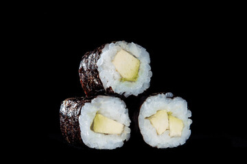 Cold cooked rice dressed with vinegar that is shaped into pieces and topped with raw or cooked fish, or formed into a roll with fish, egg, or vegetables and often wrapped in seaweed.