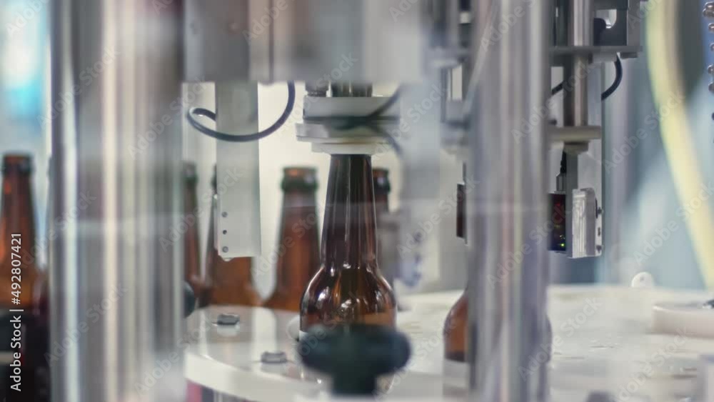 Poster at the brewery, the machine substitutes the bottles under the nozzle to fill them with beer.