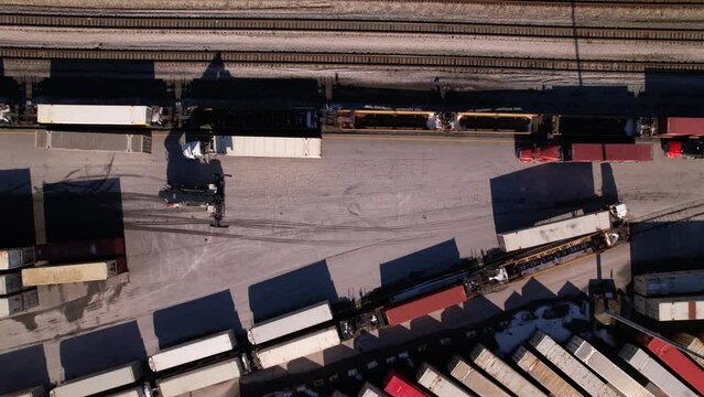 Reach stacker trolleys at work in logistic center of Vancouver in Canada. Aerial top down view