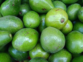 Pile Of Green Avocado In The Market