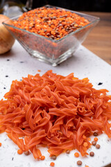 Vegan gluten free and vegetarian food, dried spiral pasta made from orange lentils legumes