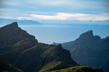 Obraz na płótnie Canvas Mountains range in Rural de Teno park near isolated village Masca on Tenerife and La Gomera island on background, Canary islands, Spain