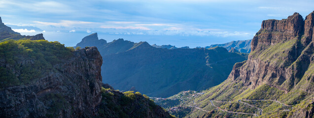 Mountains range in Rural de Teno park near isolated village Masca on Tenerife and La Gomera island on background, Canary islands, Spain - obrazy, fototapety, plakaty