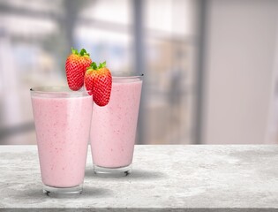 Protein rich smoothies with yogurt and frozen strawberries in glass. Bright berry