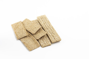 Two types of dry wheat diet light thin loaves on a white background isolated top view