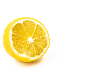 One cut citrus fruit a hybrid of orange and lemon in light yellow color on a white background isolated