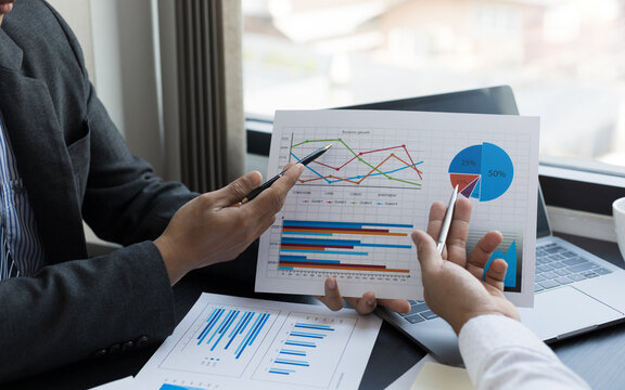 Close up business team analyzing income charts and graphs. Business analysis and strategy concept.