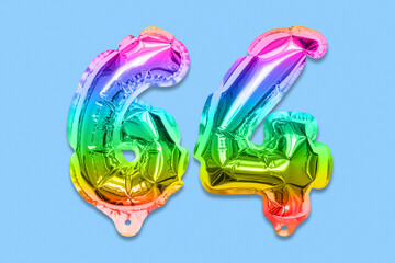 Rainbow foil balloon number, digit sixty four on a blue background. Birthday greeting card with inscription 64. Top view. Numerical digit. Celebration event, template.