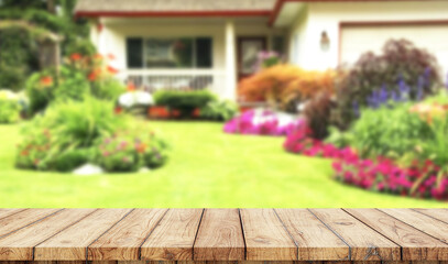 Wooden board empty table blurred garden background used for display products