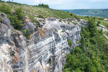 Magnificent aerial view on small tributary of the Dniester River with picturesque shores. National Nature Park Podilski Tovtry, the Dniester River, Ukraine. Beautiful view from flying drone.