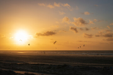 Kitesurfer off Kijkduin North Sea beach at sunset