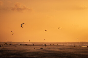 Kitesurfer at Kijkduin North Sea beach at sunset