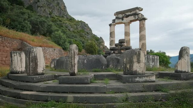 Tholos with Doric columns at the sanctuary of Athena Pronoia temple ruins in ancient Delphi, Greece. Dolly shot