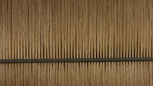Black plastic comb combing honey brown hair | Hair serum commercial