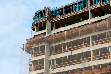 building detail under construction with protective screens