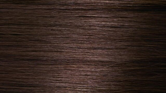 Hair texture | Vertical shot of A stick running under brown hair surface making wave | Shampoo commercial concept