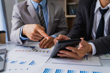 Business team presentation meeting Asian Men Finance Executive discusses meetings to plan work, investment projects, and trading strategy for trading partners. Finance and Accounting