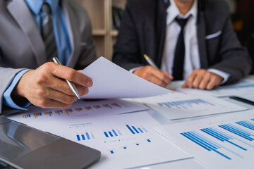 Meeting concept Business team hands at working with financial plan, meeting, discussion, brainstorm with tablet on the office desk