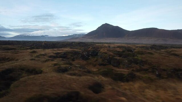 Flying over moss at sunset in Iceland
