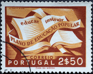 Portugal - circa 1954: a postage stamp from Portugal, showing an Open Book with a ribbon. National...